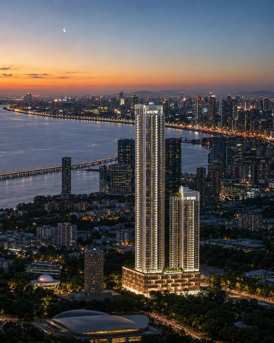 Close view of the two Godrej Trilogy towers with every floor lit after sunset